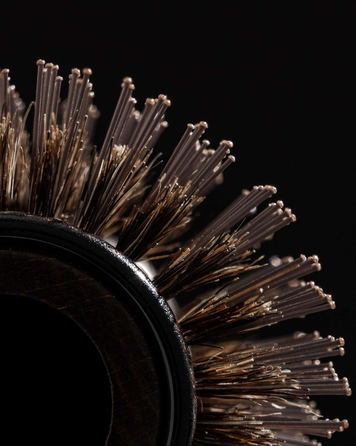 The boar bristle brush helps smooth the hair while locking in moisture and providing shine. Its unique design makes it more gentle on your hair, featuring heat-resistant nylon threads that work to distribute heat evenly from the core. 